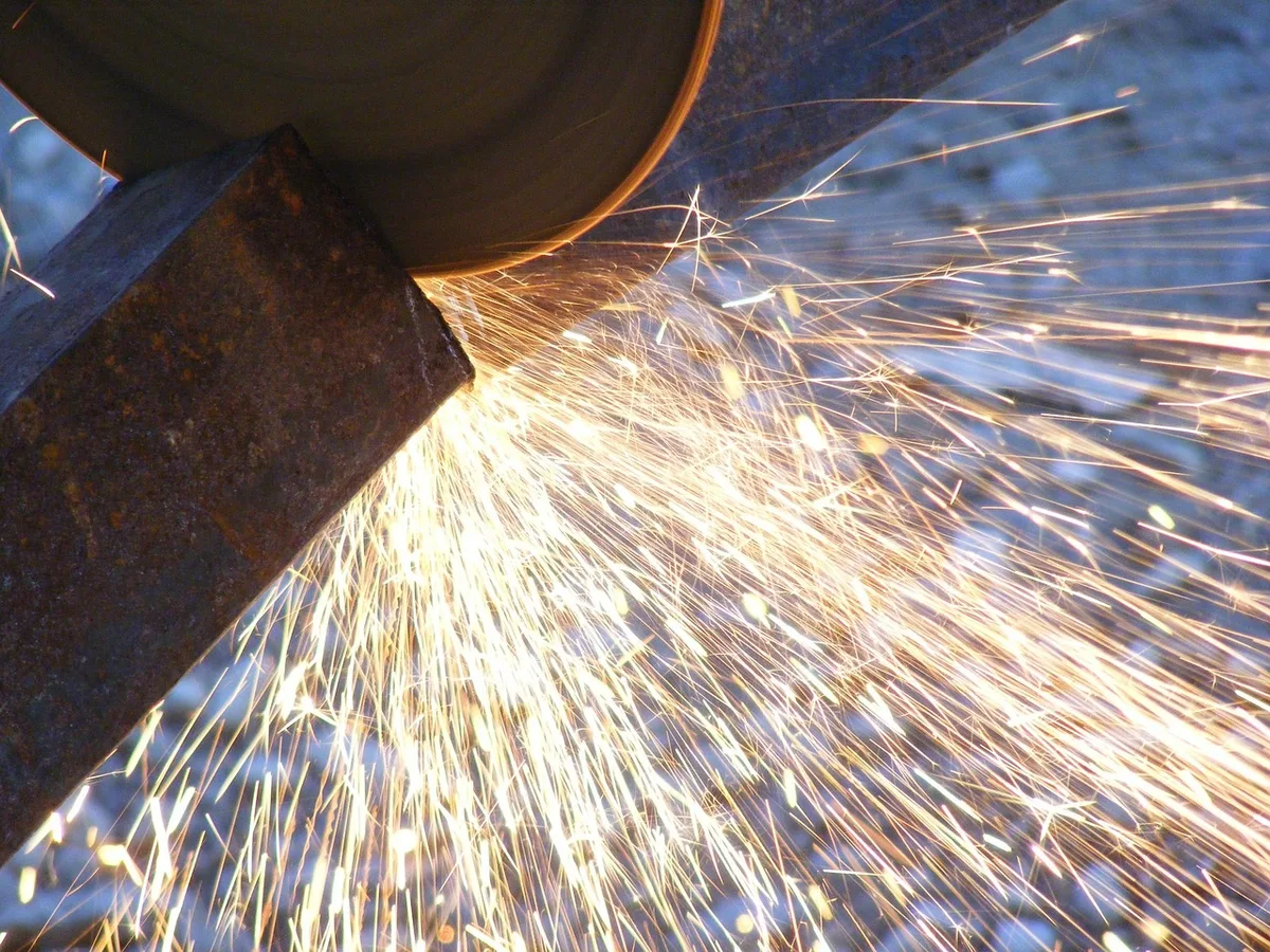angle grinder sharpening tiller blade with sparks