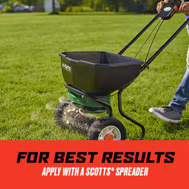 applying granular lawn insecticide spreader