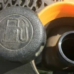 How do I clean the gas cap on my lawn mower?